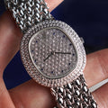 Audemars Piguet Oval-shaped Wristwatch, Diamond Bezel and Pavé Diamond Dial with Sapphires, White Gold